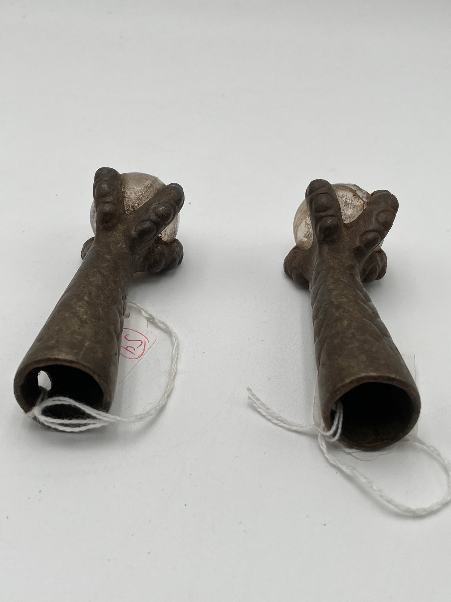 Two Antique Metal Claw Feet with Clear Glass Balls